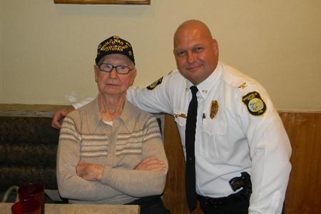 Police Officer with Arm Around Veteran